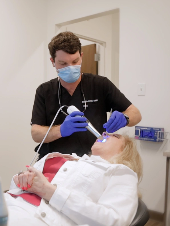Dr. Robin Hollon Mobile dentist at Hollon and Taylor Dental performing dental treatment